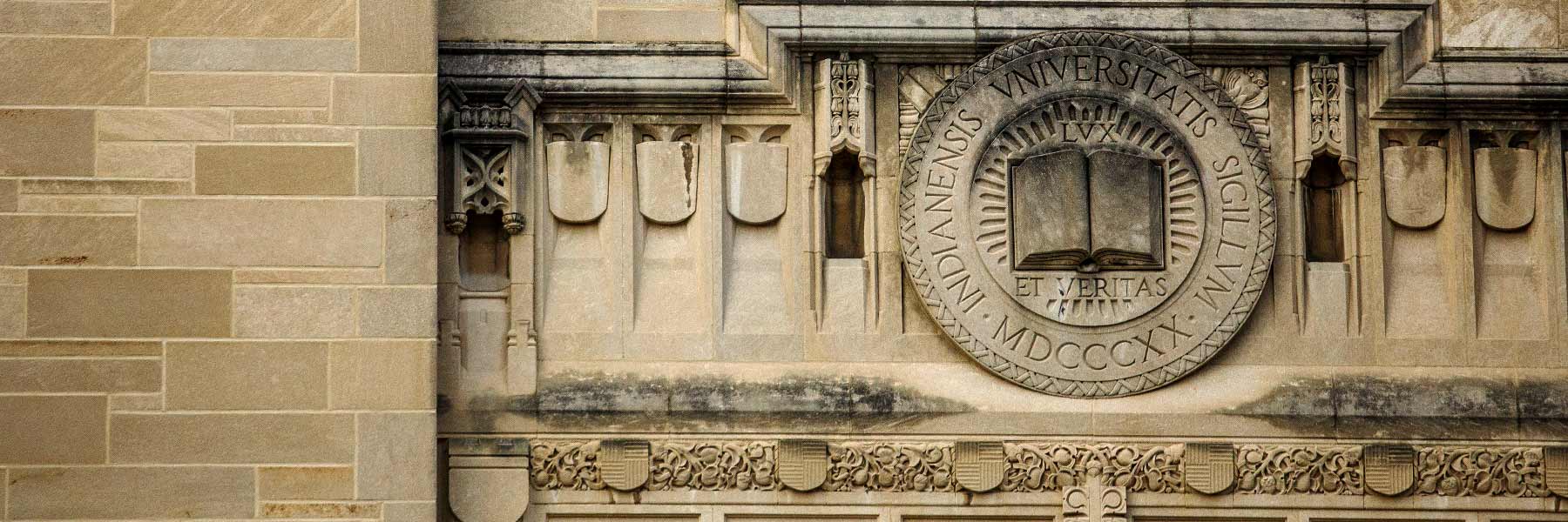 The Indiana University seal carved in limestone