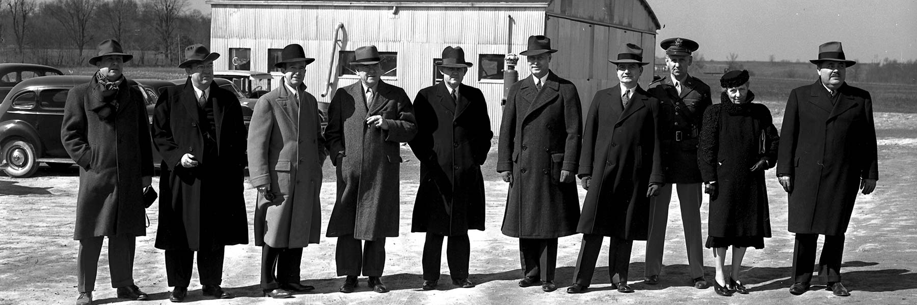Historical photo of the Board of Trustees at the Bloomington Airport, taken in 1941